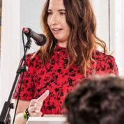 Woman speaking at a podium.